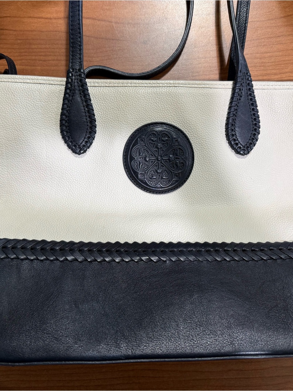 Brighton Two-Tone Black and Cream Leather Tote with Medallion